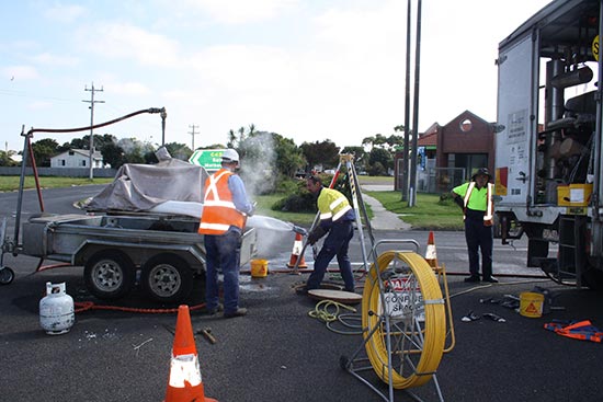 Contractors at work installing the PVC liner at Port Welshpool